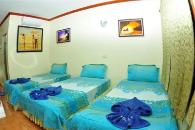 Deluxe Triple Room with Air Condition — Harmony House